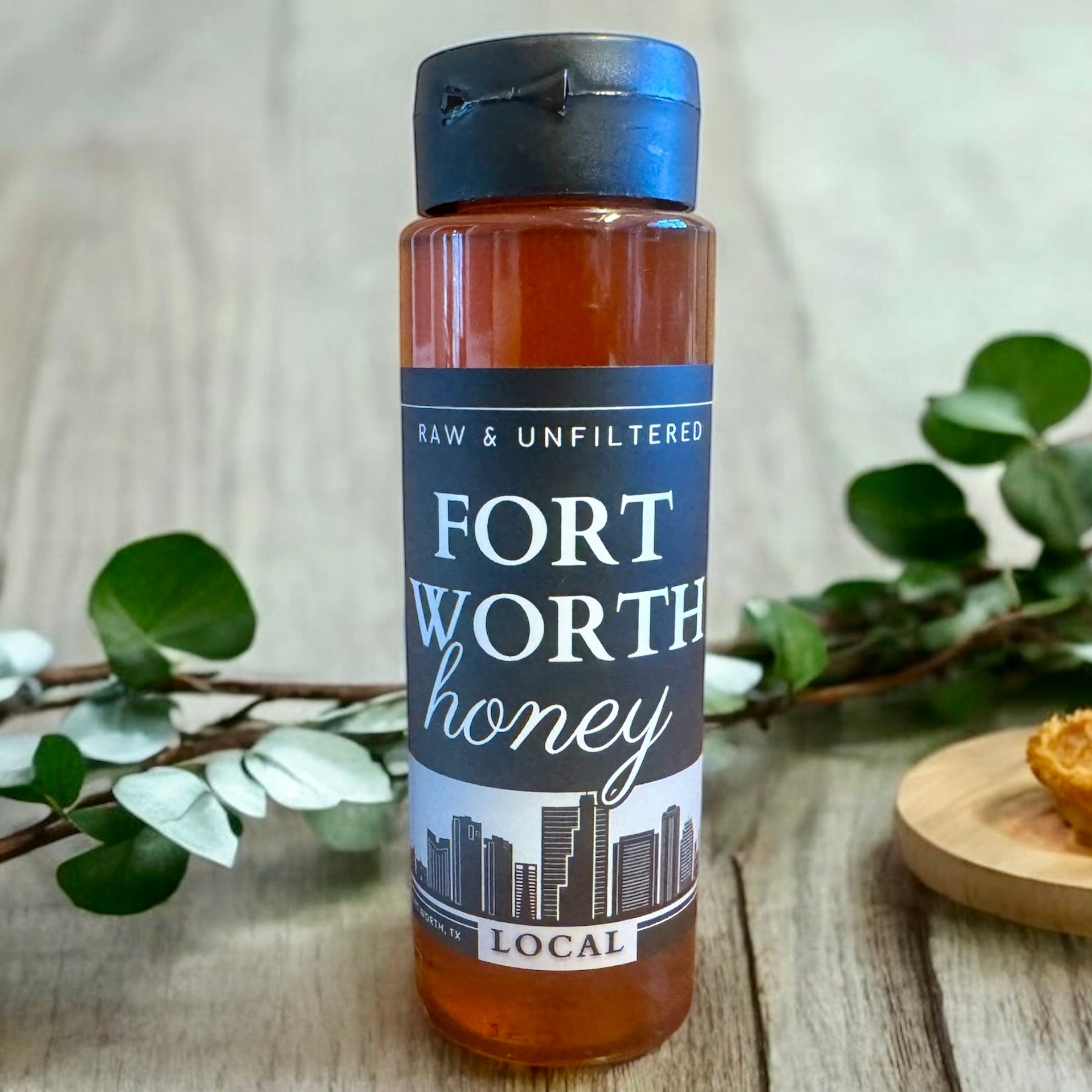 Bottle of Fort Worth Honey sitting on a table